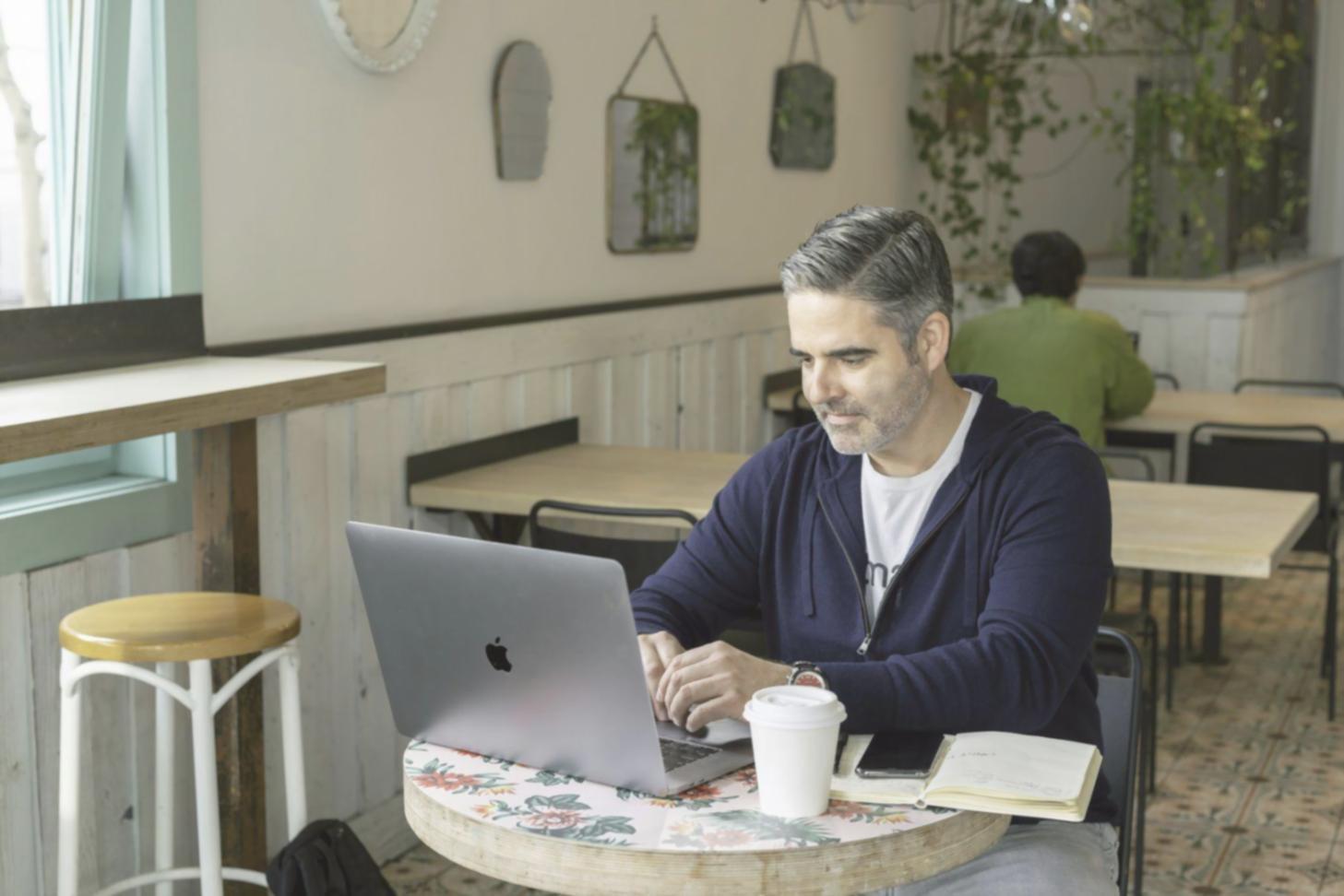 Financial analyst reviewing valuation models on multiple screens